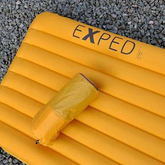 Close up of the inflated Exped SynMat UL 7M and the packsack used to store it for comparison.