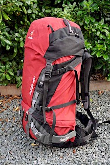 Image of a partially packed Deuter Guide 45+ in red.