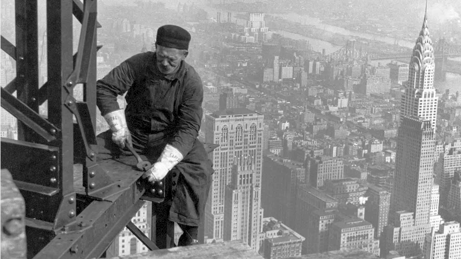Iconic image of a New York steel worker tightening bolts high above the streets of Manhattan, long before Health and Safety existed.
